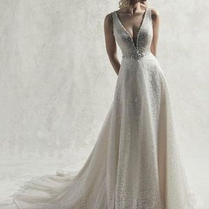 Brand new with tag. Size 12 Maggie Sottero. Never worn.